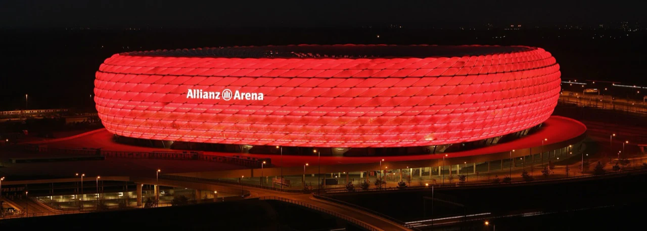 A stadium glowing at night