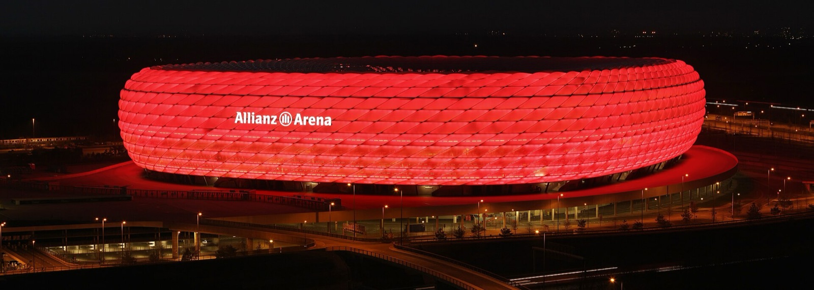 A stadium glowing at night